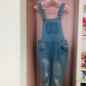 Distressed blue jean overalls